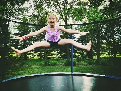 girl-on-garden-trampoline