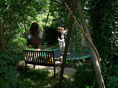 girls-on-trampoline-hidden-garden
